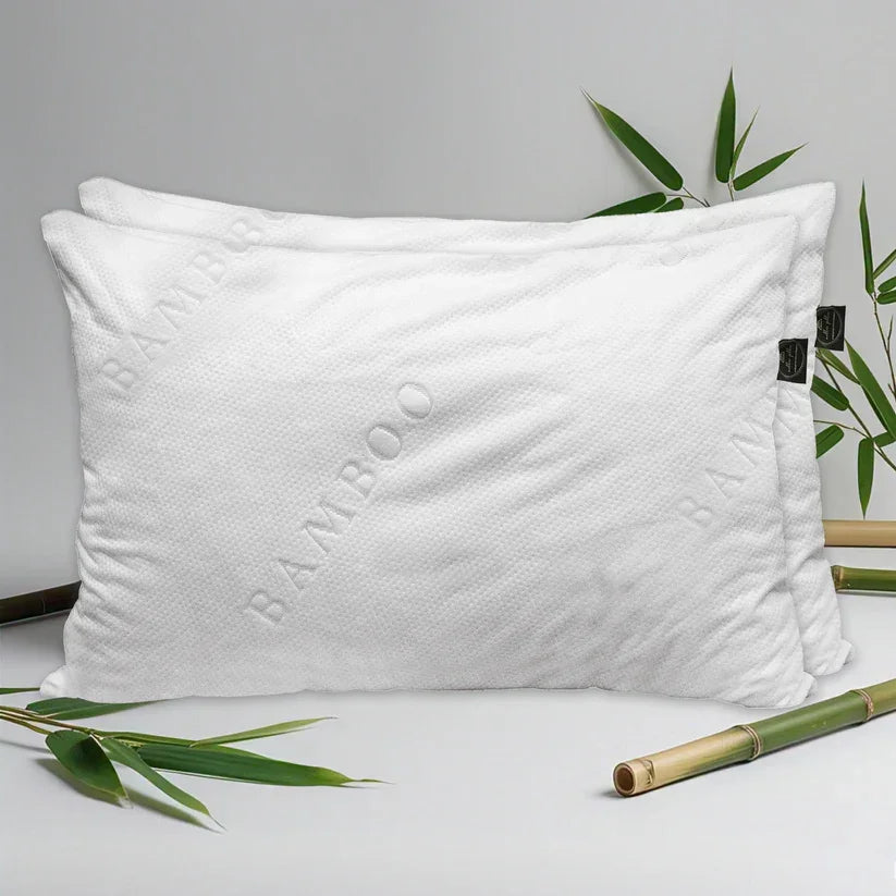 White pillow with 'Bamboo' text on a light gray background with bamboo leaves.