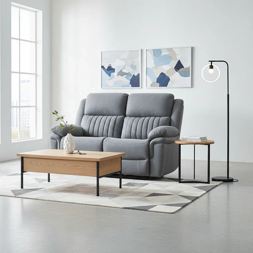 Gray sofa in a modern living room with a wooden coffee table and abstract art on the wall.