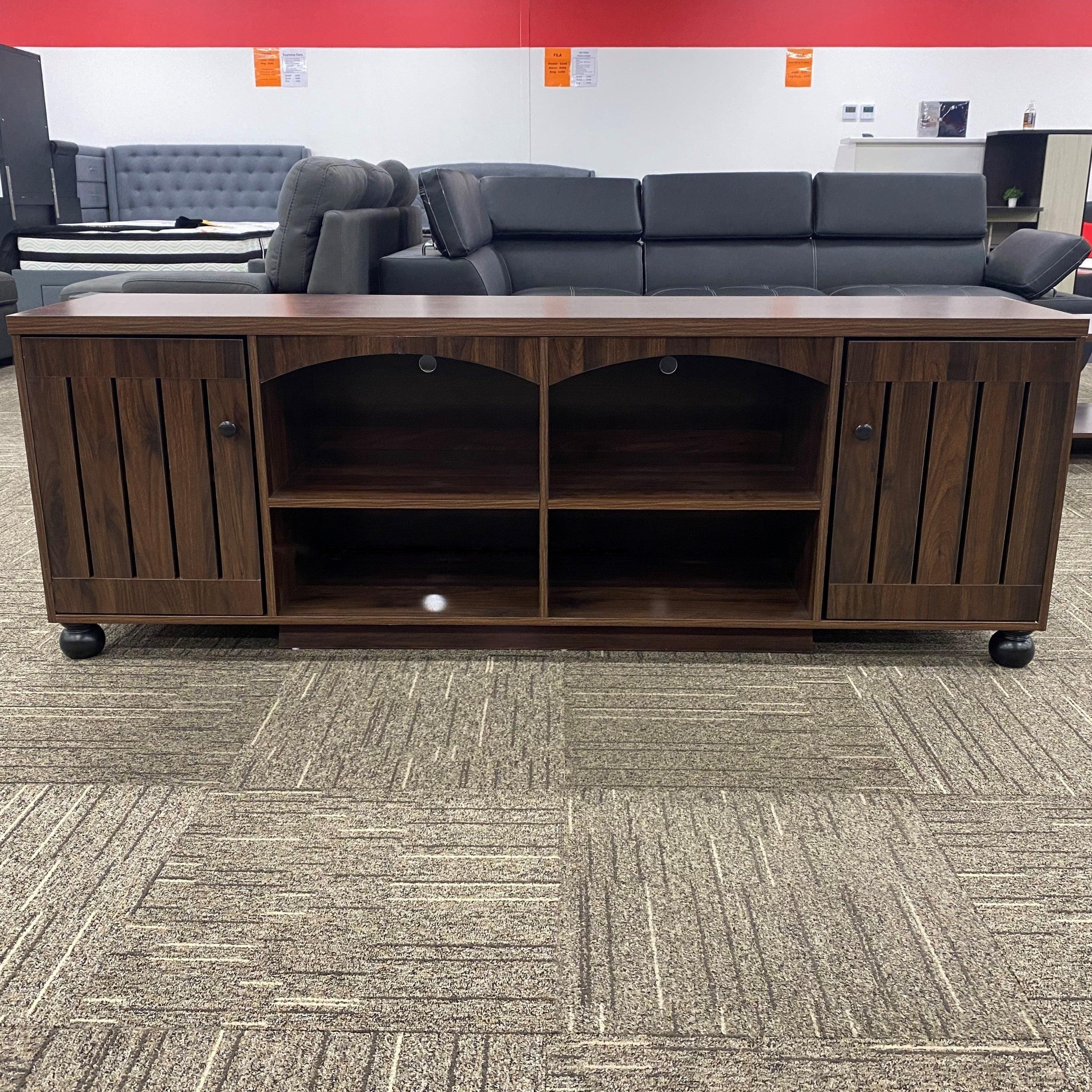 Montego TV Unit by The A2Z Furniture - a sleek and functional TV unit with 2 cabinet doors and 4 open shelves in a darker brown color.