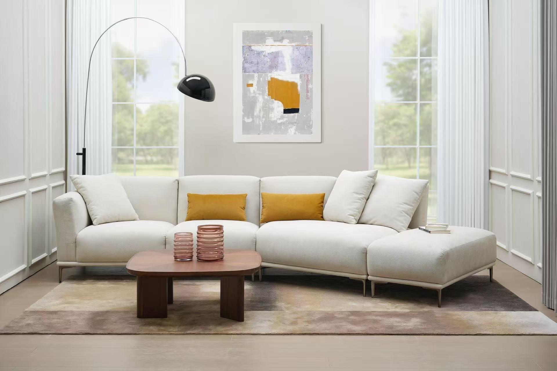 Modern living room with light L-shaped sofa, mustard cushions, wooden coffee table and floor lamp