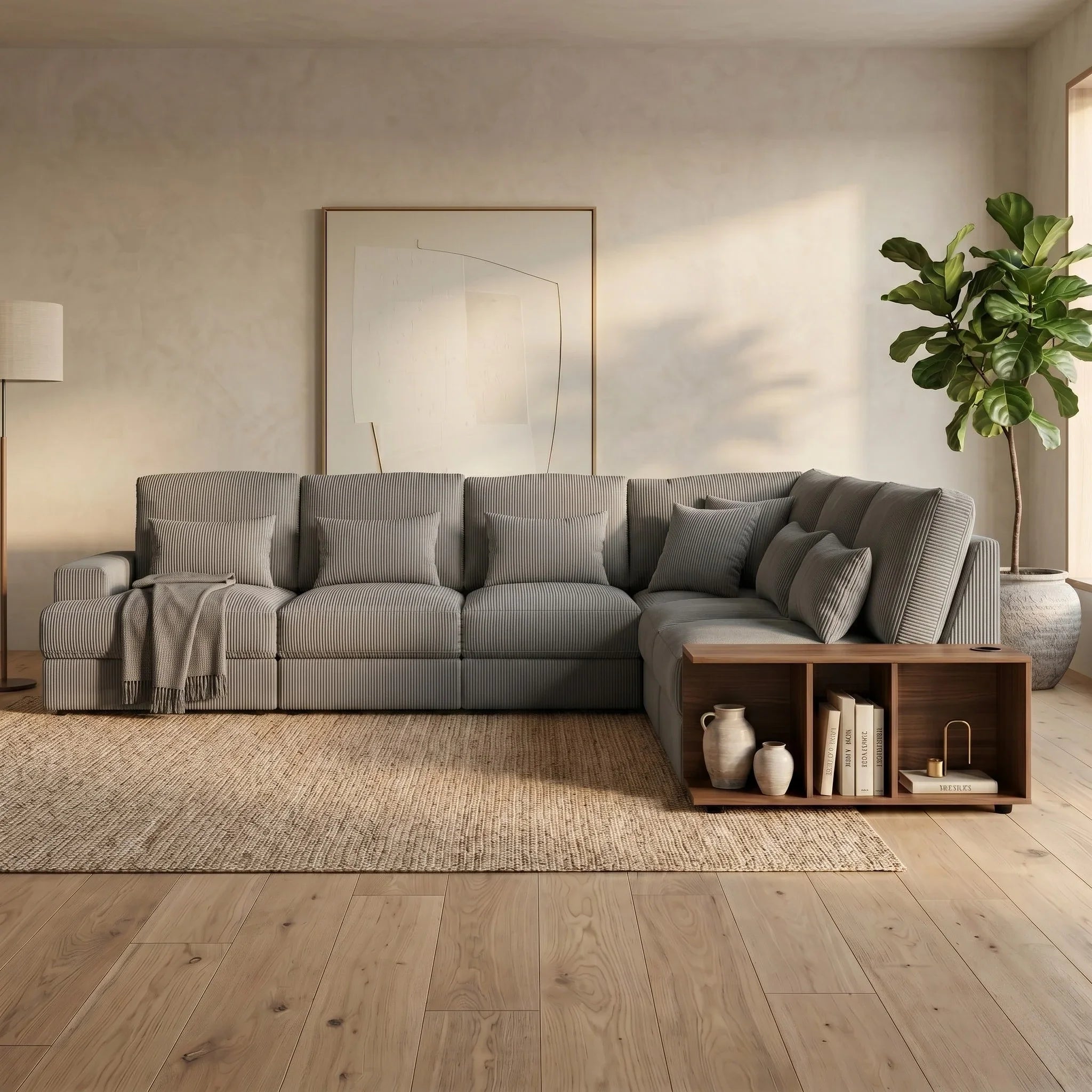Opulence Corner Sofa in soft gray fabric with plush cushions, integrated wooden side table with decor, set in a warm, minimalist living room featuring natural light and a potted plant.