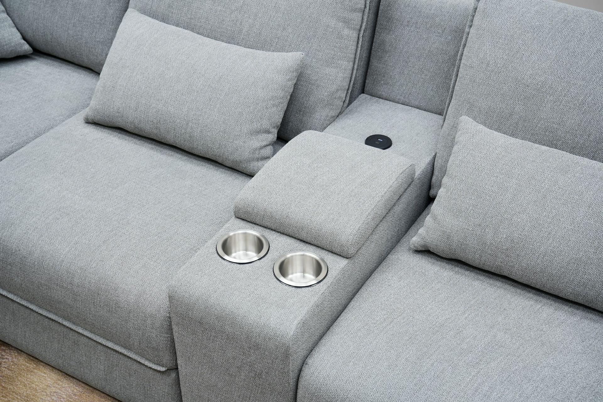 Modern light grey fabric sofa with cup holders and cushions, lounge furniture detail