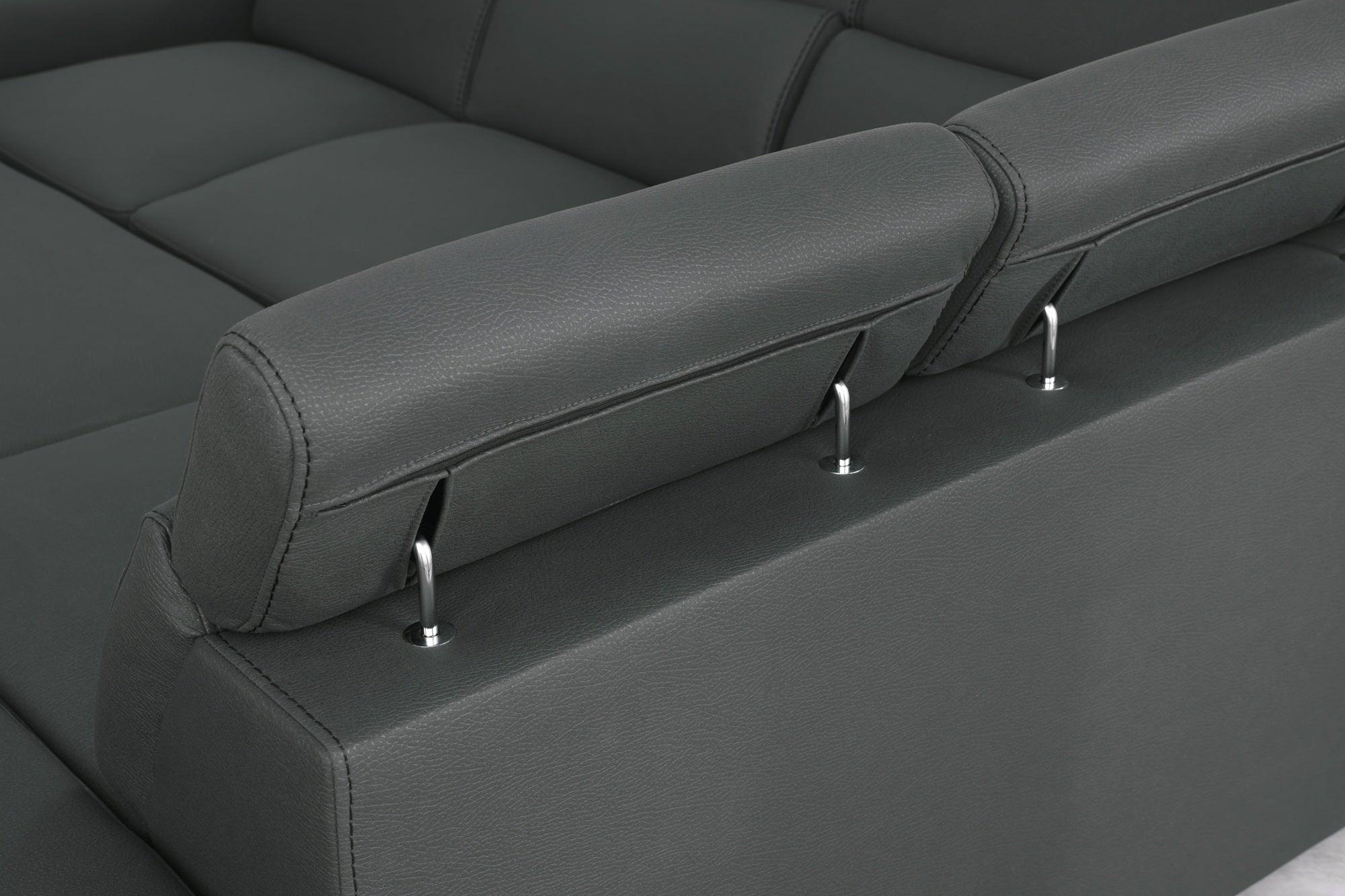 Dark grey leather sofa with adjustable headrests and chrome supports