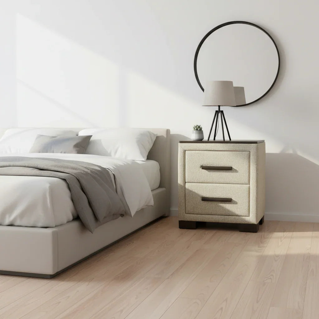 Modern bedroom with a bed and nightstand featuring a lamp.