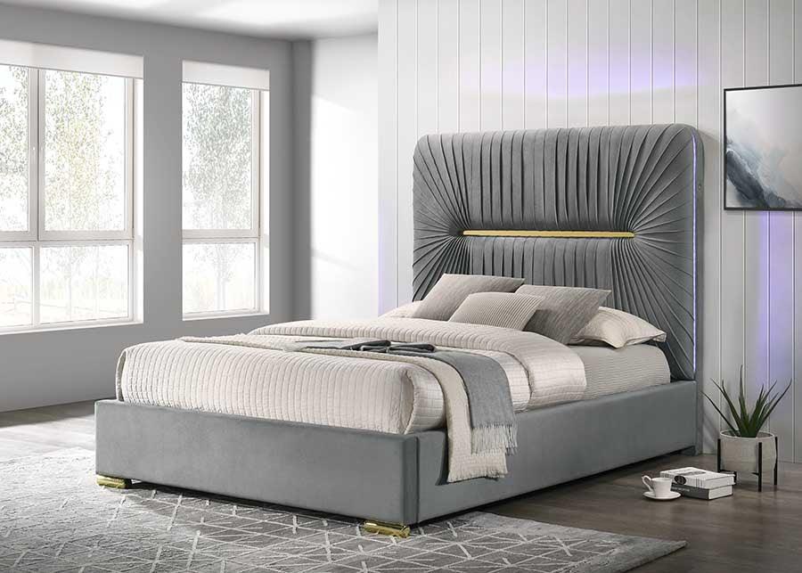 Modern grey upholstered bed with tall pleated headboard in bright contemporary bedroom