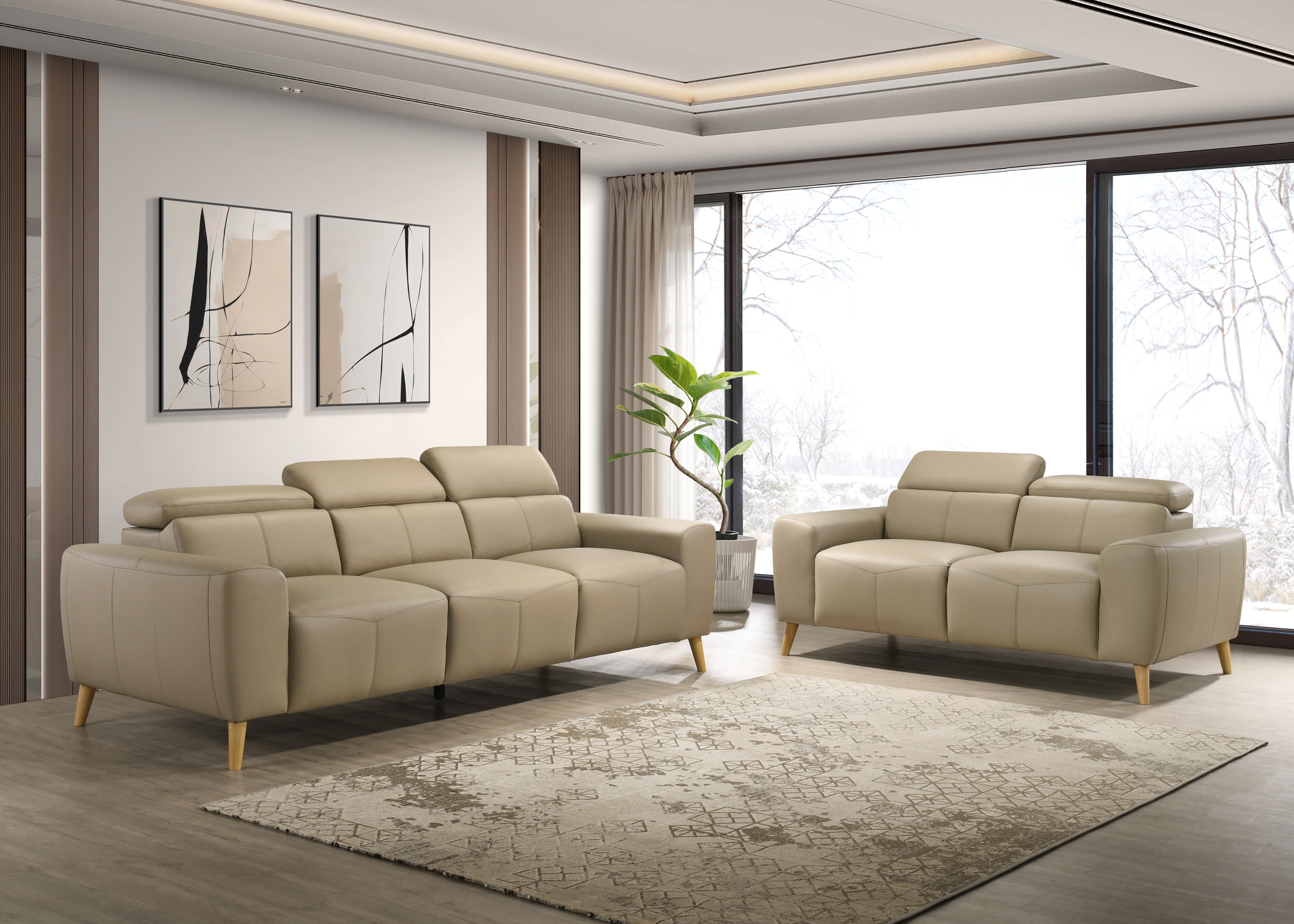Beige sectional sofa in a modern living room with large windows.