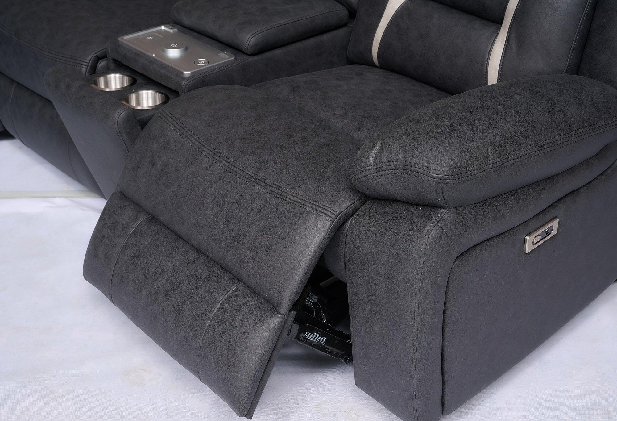 Black leather recliner sofa with cup holders, console tray, and electric controls
