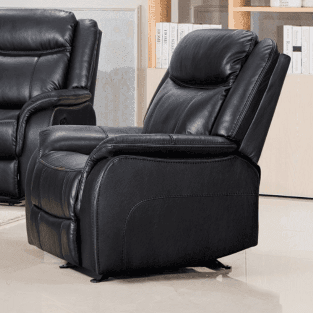 Black leather recliner armchair with padded seat and backrest in a modern living room