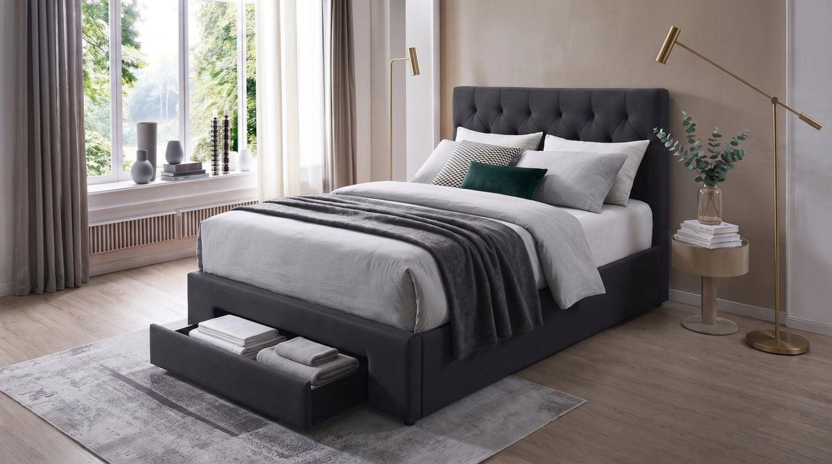 Fabulous fabric storage bed with a tufted headboard and an open storage drawer in a bedroom