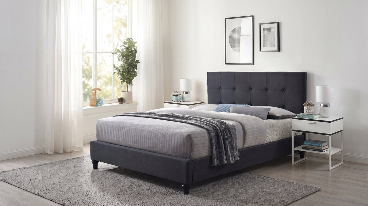 Franco upholstered bed frame with a tufted dark grey headboard in a bright bedroom