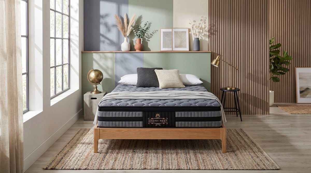 Cradle Rest 5 Zone Pocket Spring Mattress on a timber bed frame in a bedroom with a globe and brass lamp