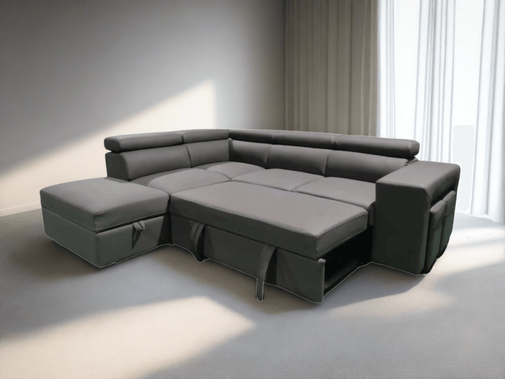 Modern living room with a stylish gray L-shaped sofa bed pulled out into a comfortable bed. Perfect for saving space and accommodating guests.