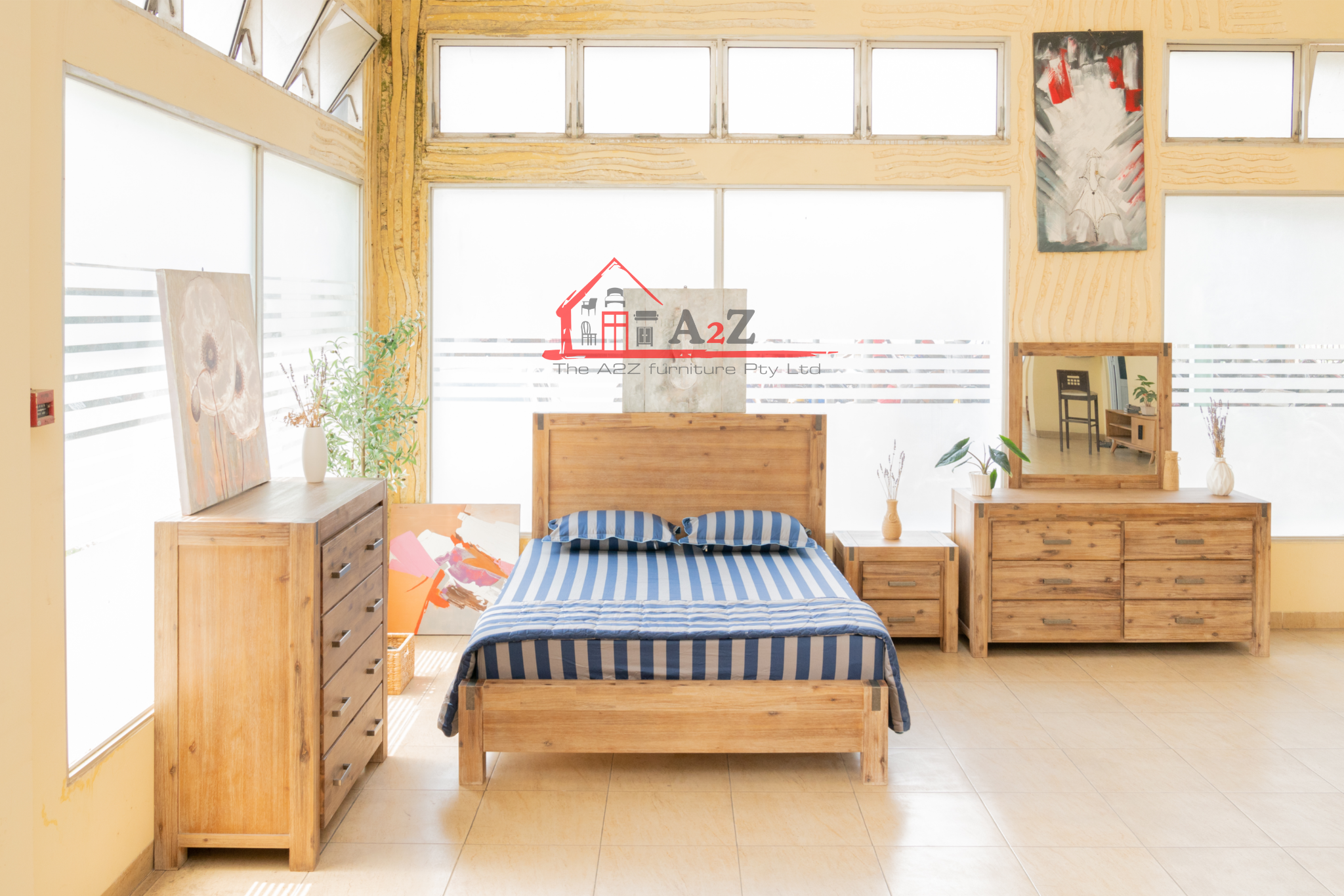 Modern king-size bed frame with plush mattress in a light-filled bedroom. 