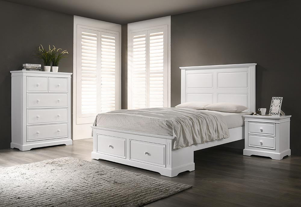 A stylish bedroom featuring a modern bed frame, bedside tables, chest of drawers, and a plush mattress.