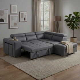 Alice Sofa Bed in grey fabric shown opened into a sleeper bed, with pull-out hideaway stools and raised headrests on a textured rug