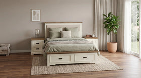 Bedroom with wooden bed, nightstands, and a plant