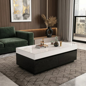 Modern living room with a green sofa, white coffee table, and abstract art on the wall.
