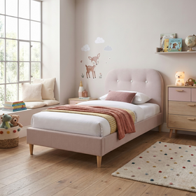 Echo Kids Bed Frame in blush pink upholstery with button-tufted curved headboard, styled in a single-bed kids room with timber floor - The A2Z Furniture