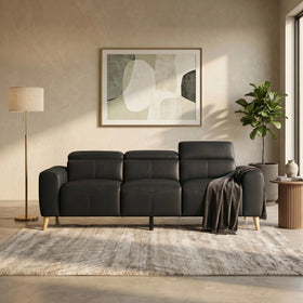 Percy 3 Seater Leather Lounge in charcoal with adjustable headrests, styled front-on with a dark throw in a warm room - The A2Z Furniture