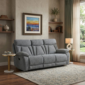 Baker 3 seater recliner lounge in grey fabric with plush padded armrests and high back, shown upright in a styled living room
