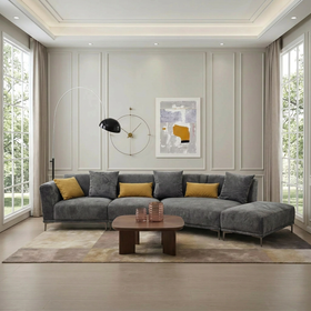 Optimus 3-Seater Curved Sofa with ottoman in Grey, styled in a living room