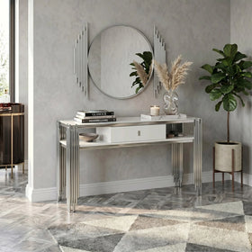 Modern interior design with a console table, mirror, and decorative items.