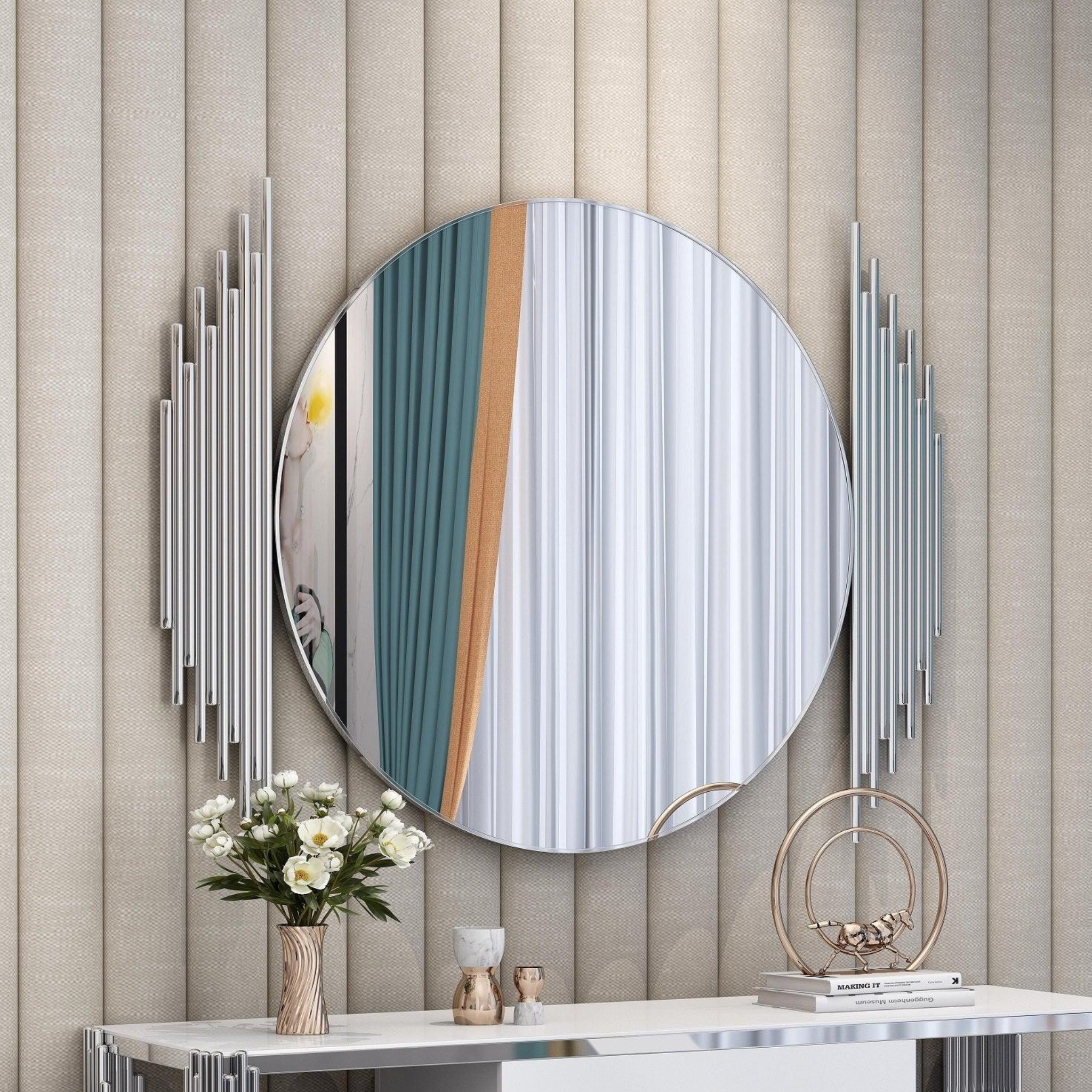 Douglas Wall Mirror. Round mirror with a silver frame, hanging on a wall. Modern home decor. 