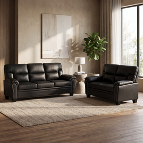 Sebastian 3 & 2 Seater PU Leather Sofa Set in black leather with studded rolled arms, styled in a modern living room