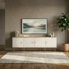 Modern living room with a TV UNit, framed landscape painting, and decorative items.