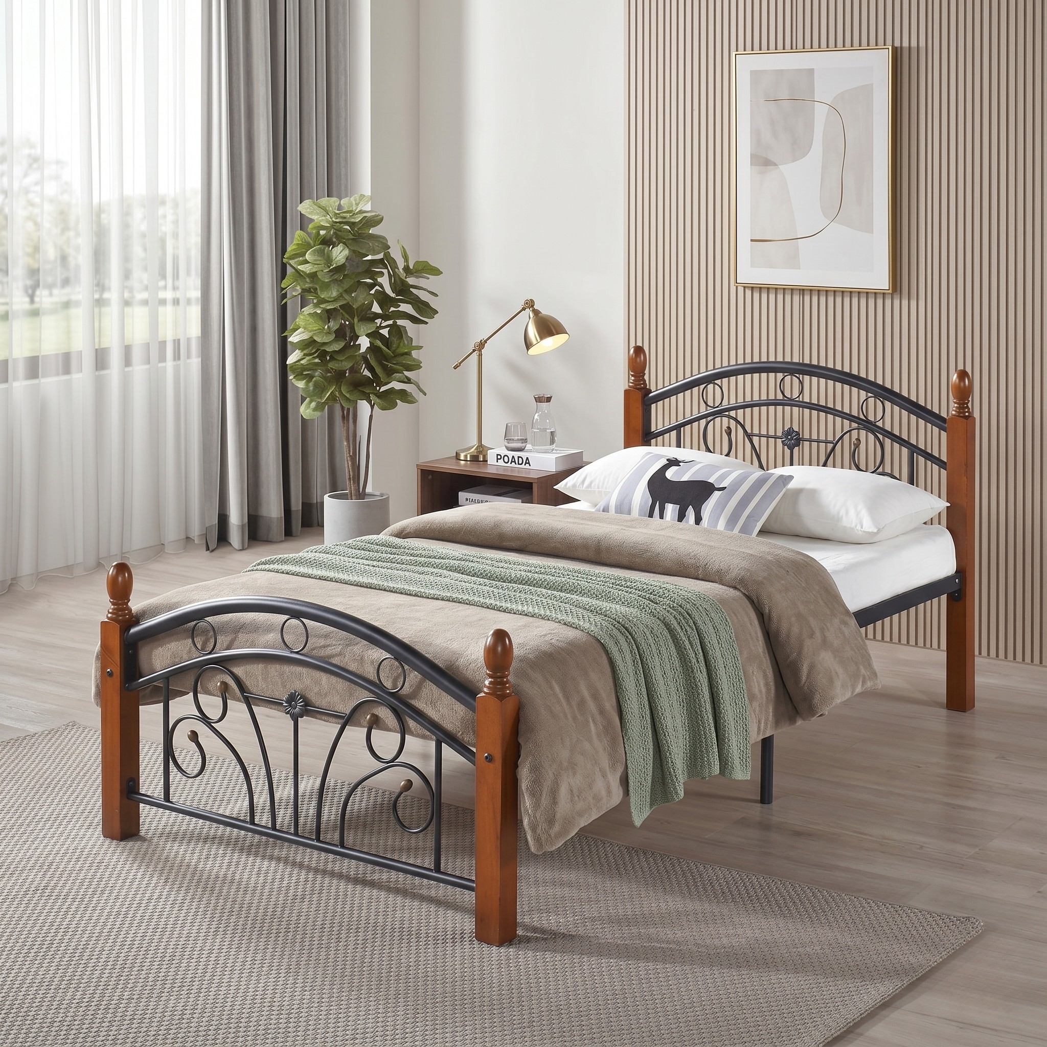 Bedroom with a metal and wood bed, nightstand, and decor elements.