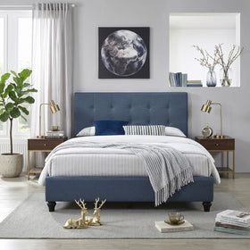 Modern bedroom featuring the Franco bed with a blue upholstered headboard and frame, flanked by wooden side tables with brass lamps, decorated with plush bedding and stylish accents.