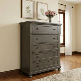 Gray tallboy with five drawers in a room with a window and framed pictures on the wall.