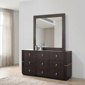 Dark wood dresser with a large mirror in a room with light-colored curtains and flooring.