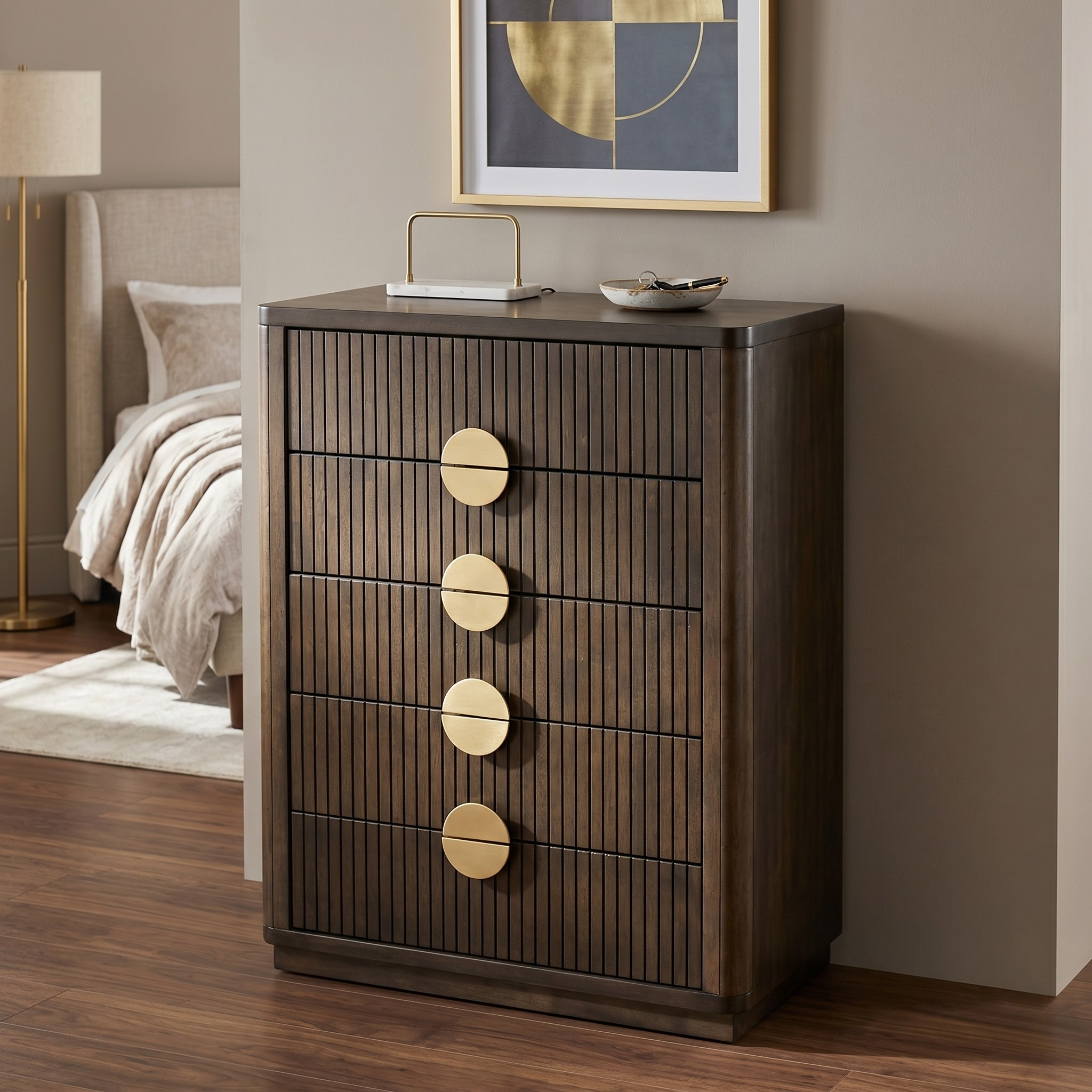 Wooden dresser with gold accents in a bedroom setting