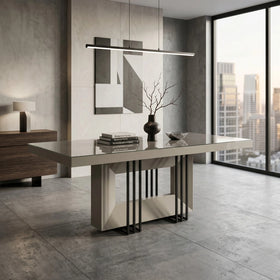 Modern dining table in a stylish room with large windows and decor elements.