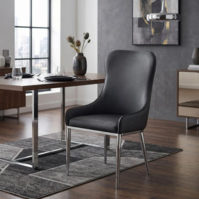 Dwayne Chair black PU leather high-back dining chair with polished chrome legs, shown beside a walnut dining table in a modern room - The A2Z Furniture