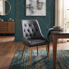 Danna dining chair in black leather-look upholstery with a diamond-tufted back and gold metal legs, in a styled dining setting - The A2Z Furniture