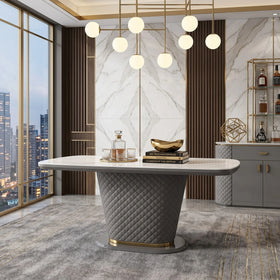 Modern interior with a stylish table, decorative items, and large windows overlooking a cityscape.