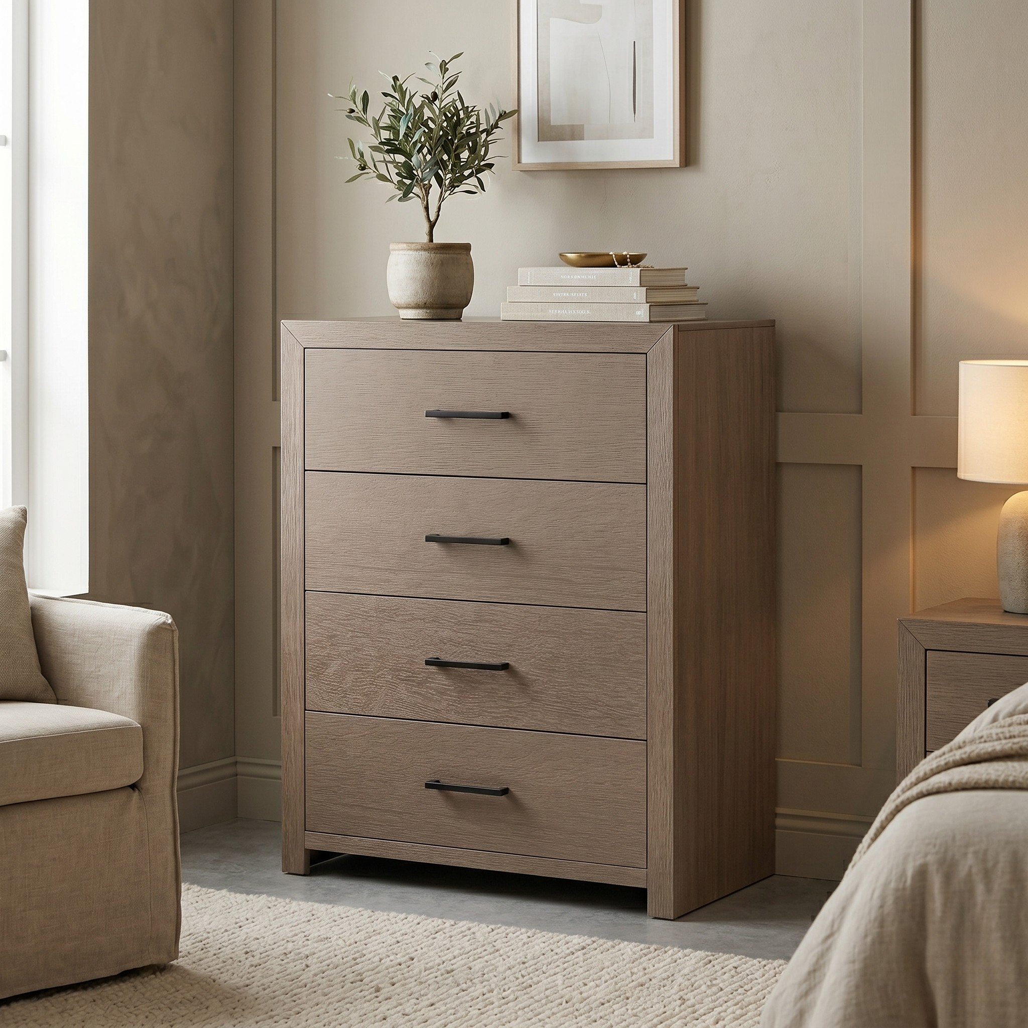 Wooden dresser with four drawers in a bedroom setting with a plant and books on top.