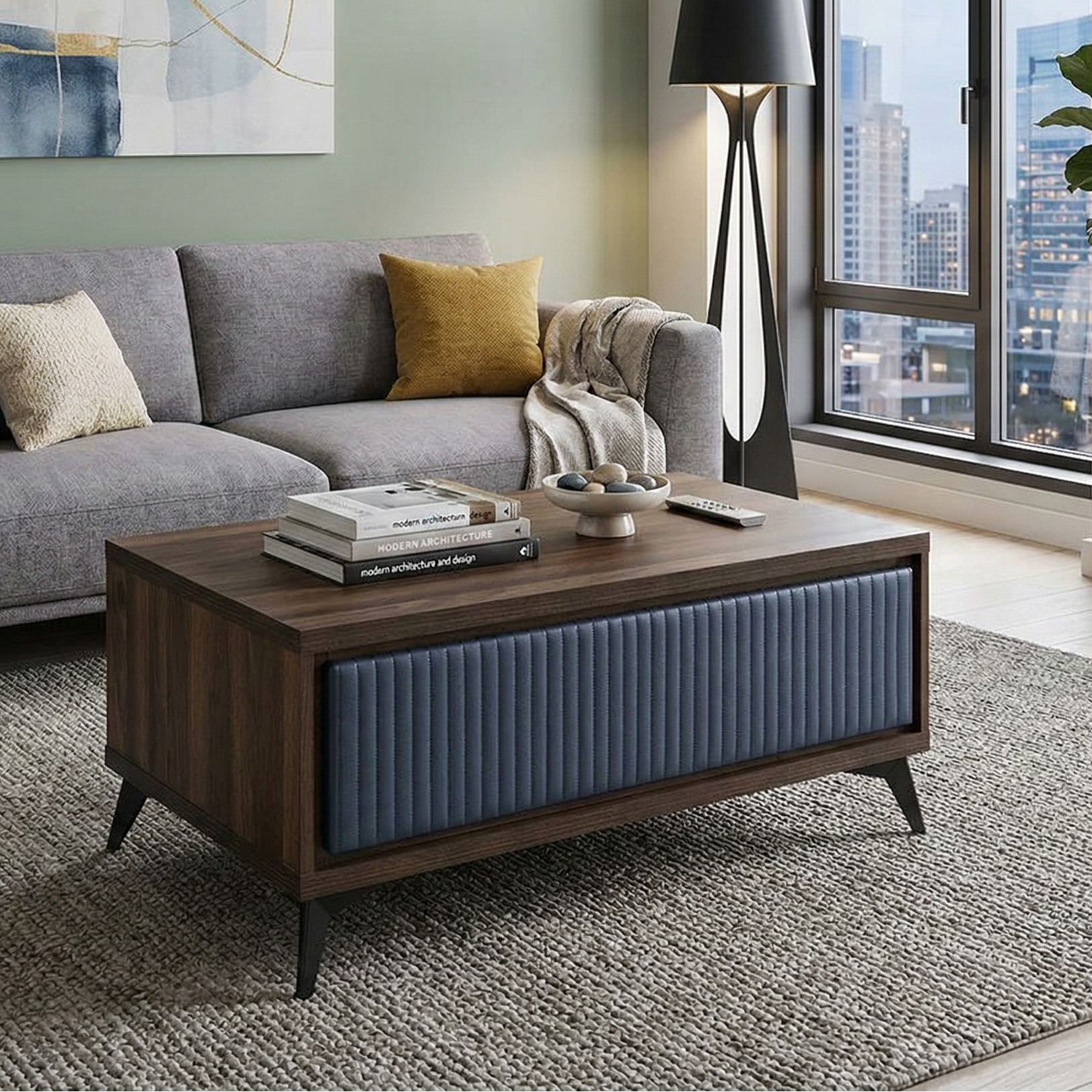 Modern living room with a grey sectional sofa, wooden coffee table, and city view.