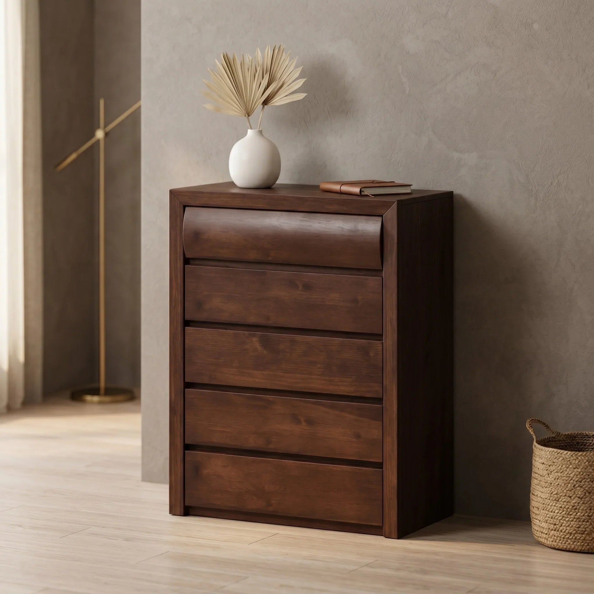 Wooden tallboy with decorative items against a neutral wall
