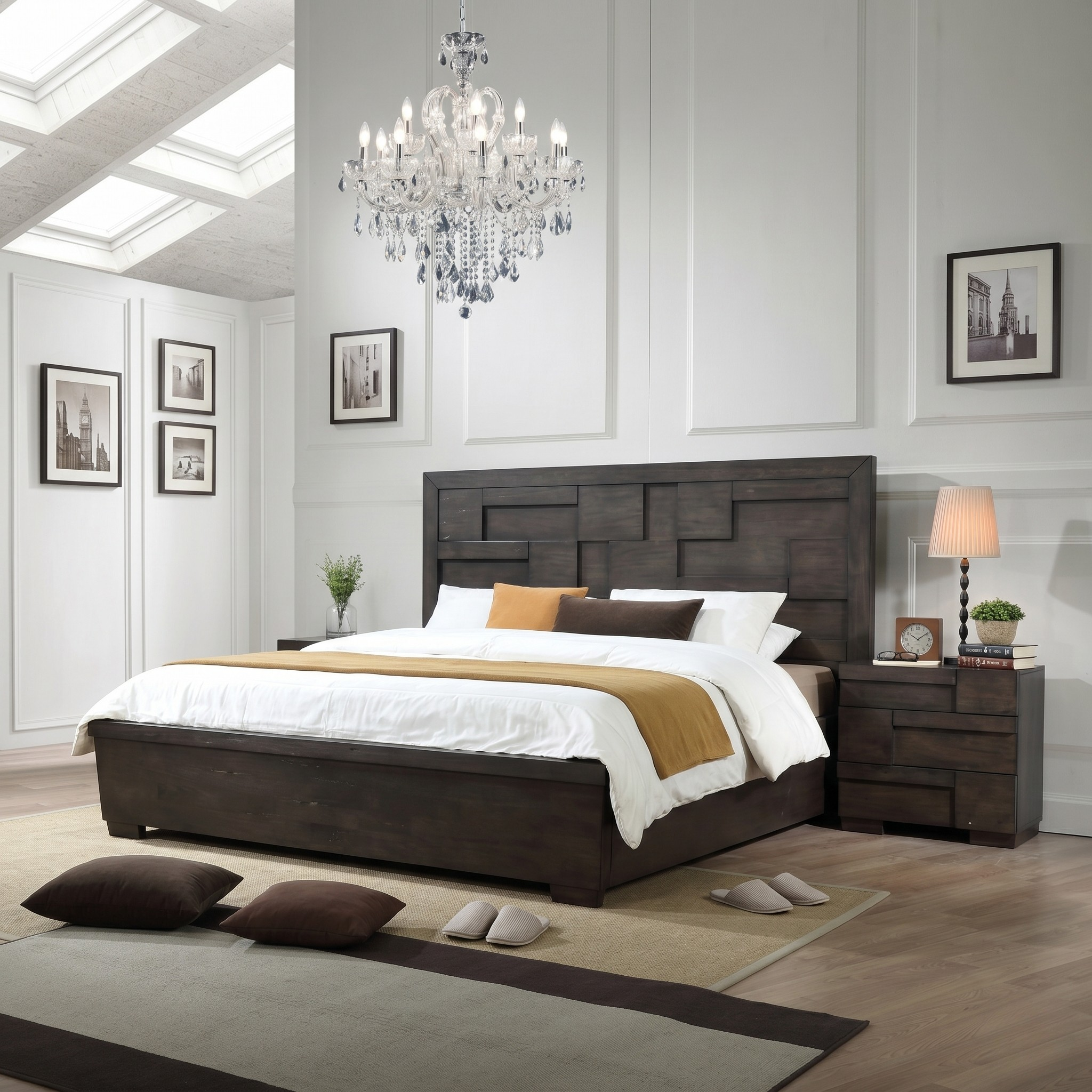 Modern bedroom with a dark wood bed, chandelier, and framed pictures on the wall.