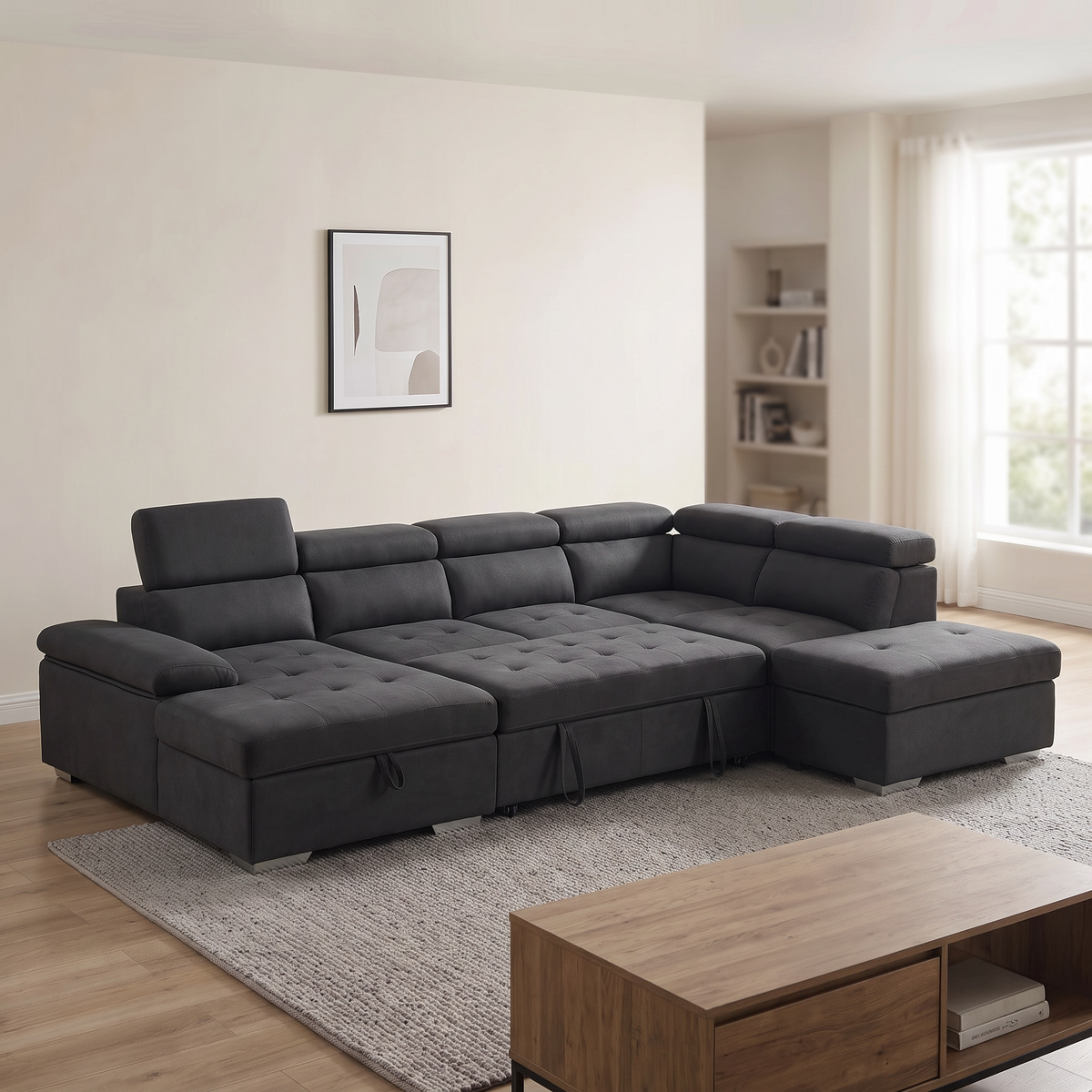 Alex Pull Out Sofa Bed in black fabric with the storage ottoman beside the sofa, adjustable headrests and chaise, in a bright living room