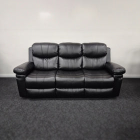 Black three-seater air leather manual recliner lounge sofa on carpeted floor