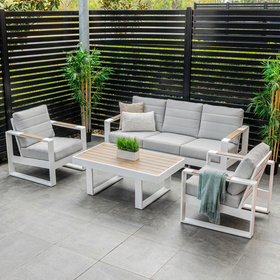 Maderia 4 Piece Outdoor Sofa Set in white - 3-seater sofa, two armchairs, and coffee table with Polywood top on an outdoor patio