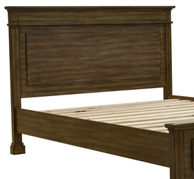 Wooden bed frame with high headboard and slatted base in a bedroom setting