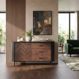 Wooden sideboard in a modern living room with abstract art and decor.