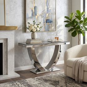 Zone Hall Table with grey marble top and curved polished chrome base, styled with flowers and books in an elegant living room - The A2Z Furniture