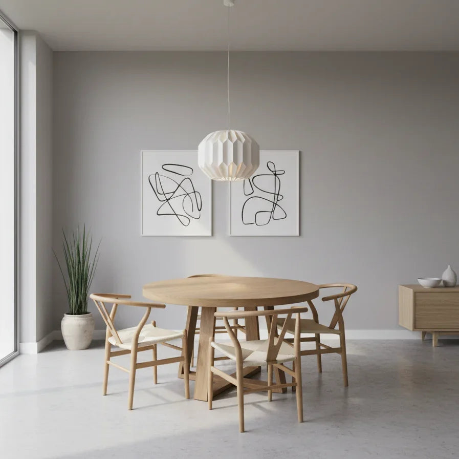 Modern dining room with wooden table and chairs, abstract wall art, and a pendant light.