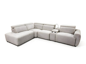 Auburn Corner Lounge in Beige, three-quarter view showing the chaise, corner seat, console with reading light and armed end seat